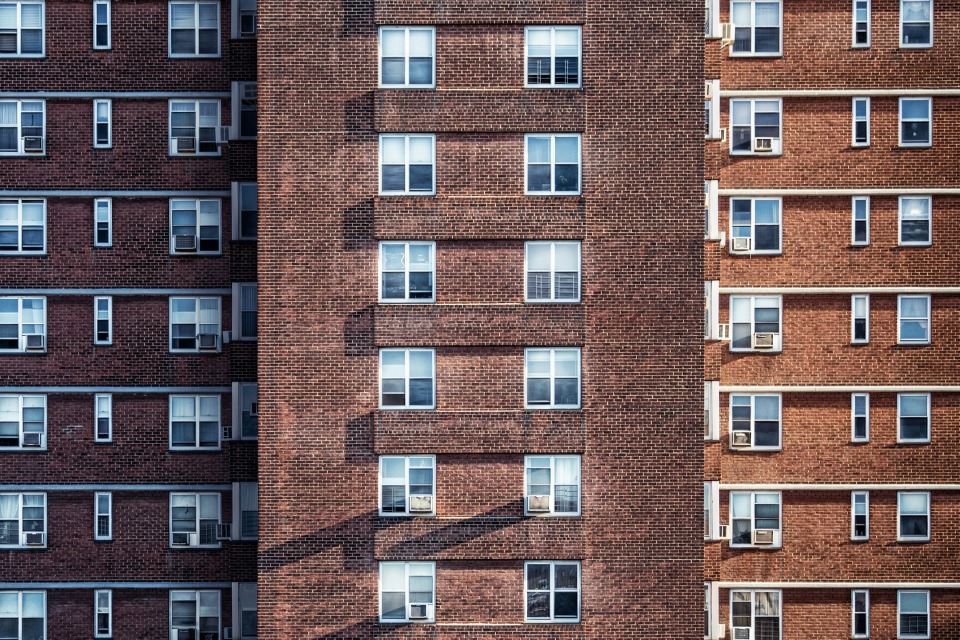 Brick apartment building with many windows